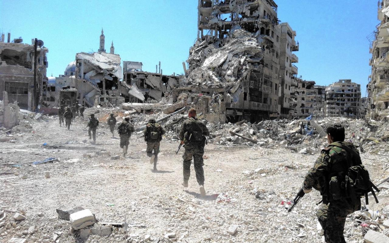 la-afp-getty-syria-conflict-anniversary-files3-j-201403271443277080.jpg