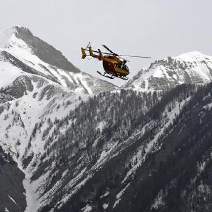 26f5247300000578-3009151-a_rescue_helicopter_flies_over_pieces_of_debris_the_search_opera-a-27_1427232197345.jpg